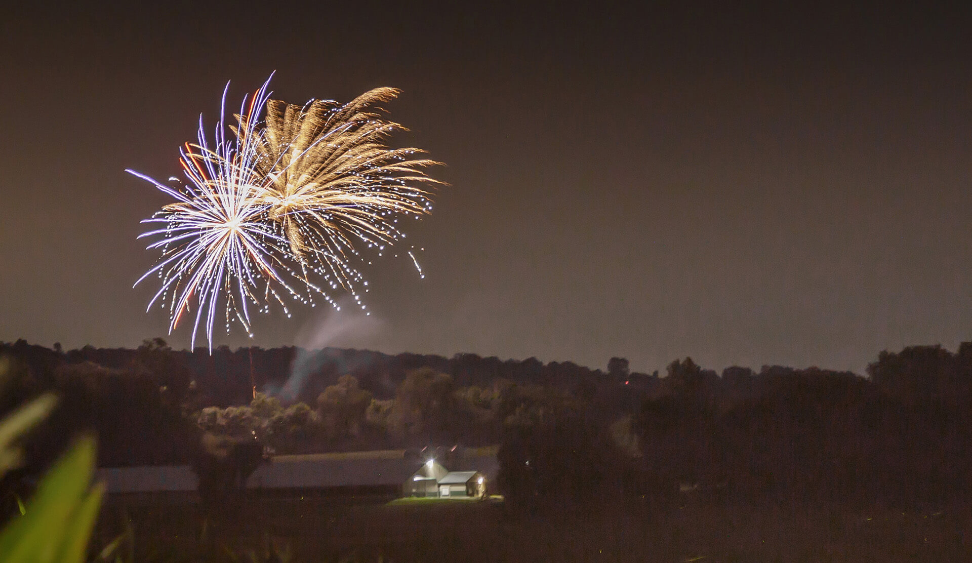 fireworks over a barn